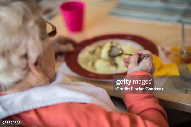 An old woman having lunch in a nursing home on April 27, 2018 in Berlin, Germany.