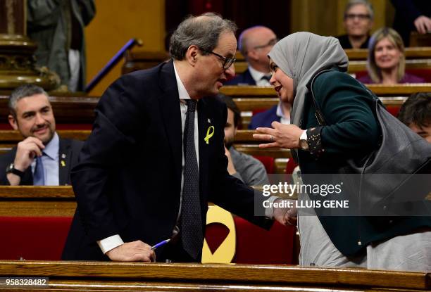 Junts per Catalonia MP and presidential candidate Quim Torra greets 'Esquerra Republicana de Catalunya' - ERC MP Najat Driouech during a vote session...