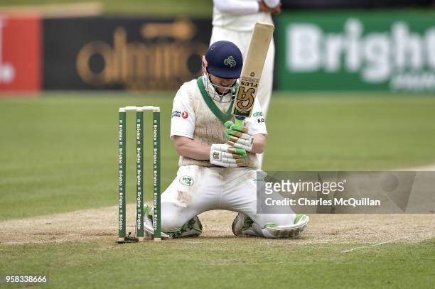 Niall O'Brien of Ireland smiles as he avoids being run out during the fourth day of the international test cricket match between Ireland and Pakistan...
