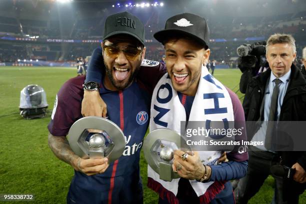 Dani Alves of Paris Saint Germain, Neymar Jr of Paris Saint Germain celebrates the championship with the trophy during the French League 1 match...
