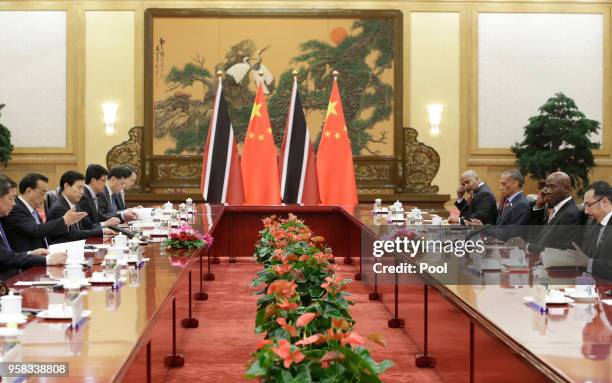 China's Premier Li Keqiang and Trinidad and Tobago Prime Minister Keith Rowley attend a meeting at the Great Hall of the People on May 14, 2018 in...