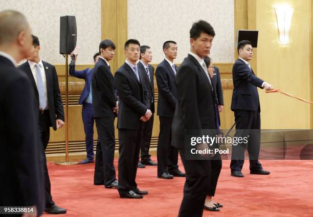 Security personnel are seen during a meeting between China's Premier Li Keqiang and Trinidad and Tobago Prime Minister Keith Rowley at the Great Hall...