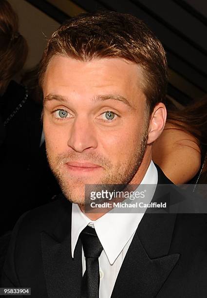Actor Jesse Spencer signs the Chrysler 300 Eco Style car for Stars for a Cause during the 67th annual Golden Globe Awards held at The Beverly Hilton...