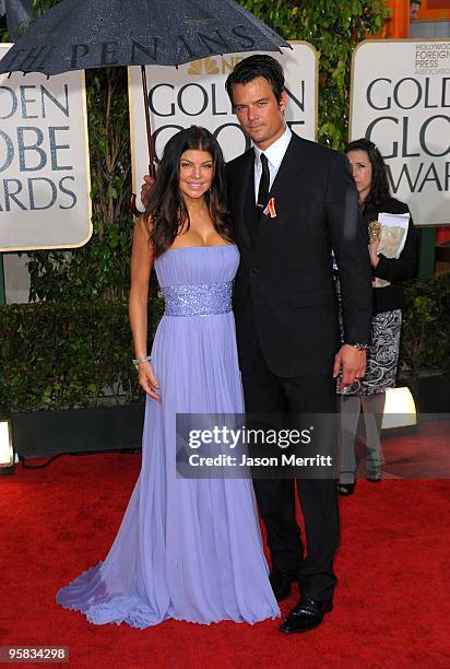 Singer Fergie of The Black Eyed Peas and actor Josh Duhamel arrive at the 67th Annual Golden Globe Awards held at The Beverly Hilton Hotel on January...