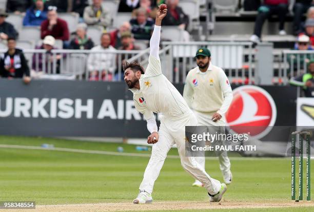 Pakistan's Mohammad Amir bowls to take the wicket of Ireland's Niall O'Brien during play on day four of Ireland's inaugural test match against...