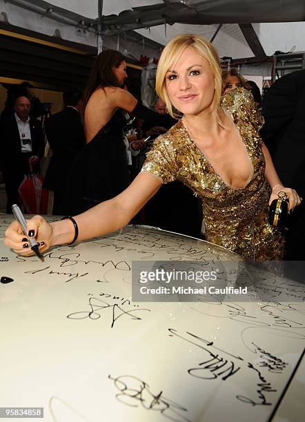 Actress Anna Paquin signs the Chrysler 300 Eco Style car for Stars for a Cause during the 67th annual Golden Globe Awards held at The Beverly Hilton...