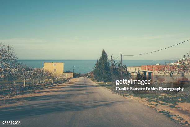 scenic view of a coastal landscape against clear sky - samere fahim bildbanksfoton och bilder