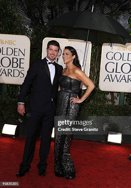 Singer Robin Thicke and wife actress Paula Patton arrive at the 67th Annual Golden Globe Awards at The Beverly Hilton Hotel on January 17, 2010 in...