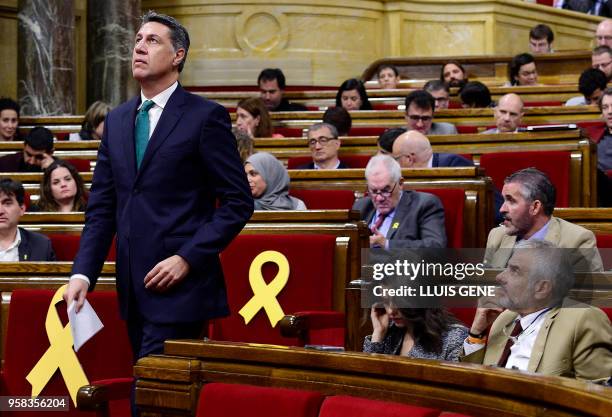 Catalan Popular Party - PPC MP Xavier Garcia Albiol walks to speak during a vote session to elect a new regional president at the Catalan parliament...