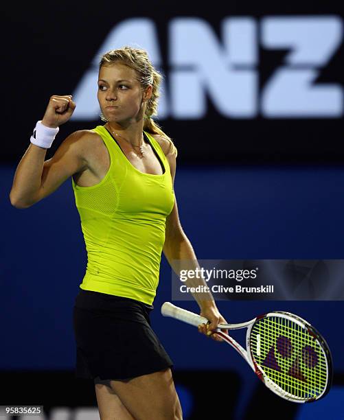 Maria Kirilenko of Russia celebrates winning the first set in her first round match against Maria Sharapova of Russia during day one of the 2010...