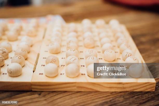 high angle view of bingo balls arranged - bingo stockfoto's en -beelden