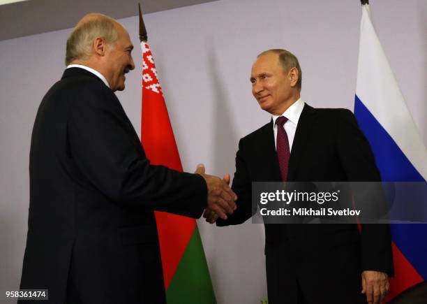 Russian President Vladimir Putin shakes hands with Belarussian President Alexander Lukashenko during their bilateral meeting prior to the Eurasian...