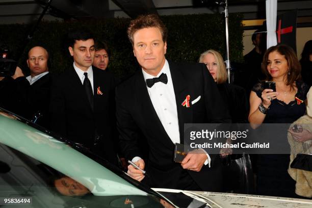 Actor Colin Firth signs the Chrysler 300 Eco Style car for Stars for a Cause during the 67th annual Golden Globe Awards held at The Beverly Hilton...