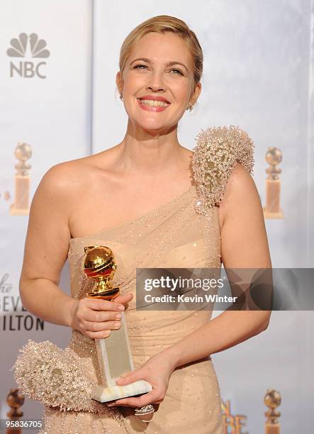 Actress Drew Barrymore poses with her Best Performance by an Actress in a Mini-Series or a Motion Picture Made for Television award for "Grey...