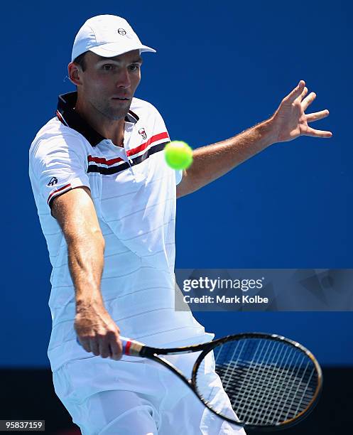 Ivo Karlovic of Croatia plays a backhand in his first round match against Radek Stepanek of the Czech Republic during day one of the 2010 Australian...