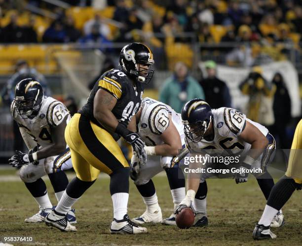 Defensive lineman Casey Hampton of the Pittsburgh Steelers looks across the line of scrimmage at offensive linemen Phil Bogle, Michael Keathley and...