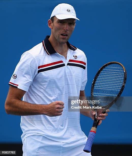 Ivo Karlovic of Croatia celebrates winning a point in his first round match against Radek Stepanek of the Czech Republic during day one of the 2010...