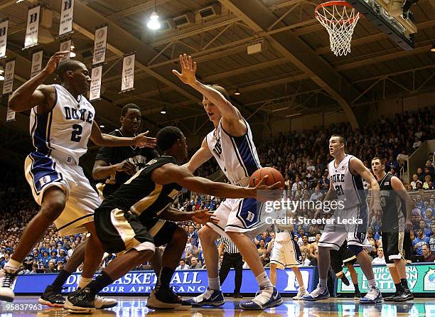 Kyle Singler of the Duke Blue Devils tries to stop Ishmael Smith of the Wake Forest Demon Deacons at Cameron Indoor Stadium on January 17, 2010 in...