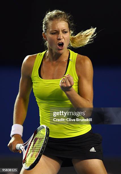 Maria Kirilenko of Russia celebrates winning a point in her first round match against Maria Sharapova of Russia during day one of the 2010 Australian...