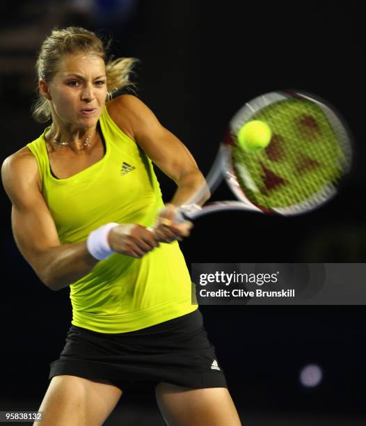 Maria Kirilenko of Russia plays a backhand in her first round match against Maria Sharapova of Russia during day one of the 2010 Australian Open at...