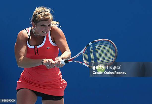 Timea Bacsinszky of Switzerland plays a backhand in her first round match against Yvonne Meusburger of Austria during day one of the 2010 Australian...