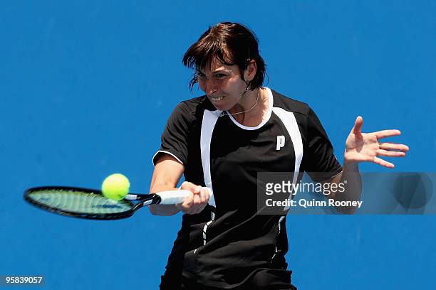 Yvonne Meusburger of Austria plays a forehand in her first round match against Timea Bacsinszky of Switzerland during day one of the 2010 Australian...
