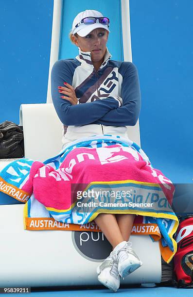 Anastasia Rodionova of Australia sits in the players chair in her first round match against Svetlana Kuznetsova of Russia during day one of the 2010...