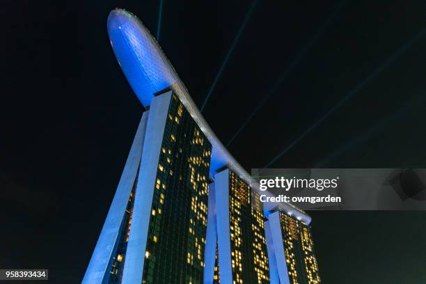 singapore marina bay sands night neon laser light show - laser light show stock pictures, royalty-free photos & images
