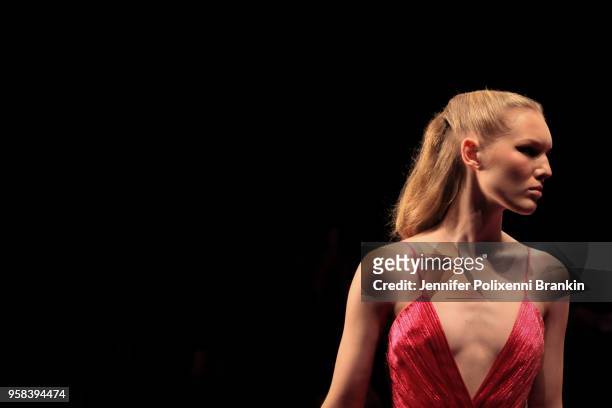 Model walks the runway during the Alice McCall show at Mercedes-Benz Fashion Week Resort 19 Collections at Carriageworks on May 14, 2018 in Sydney,...