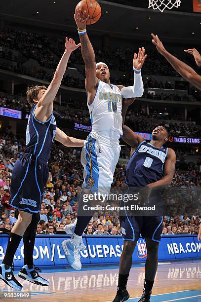 Carmelo Anthony of the Denver Nuggets goes to the basket against Ronnie Brewer of the Utah Jazz on January 17, 2010 at the Pepsi Center in Denver,...