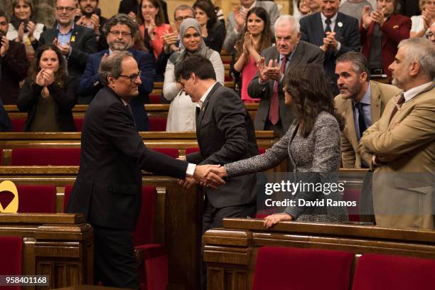 Quim Torra shakes hands with Ines Arrimadas, leader of Ciudadanos, after being elected as the new President of Catalonia during the second day of the...