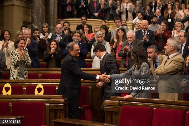 Quim Torra shakes hands with Ines Arrimadas, leader of Ciudadanos, after being elected as the new President of Catalonia during the second day of the...