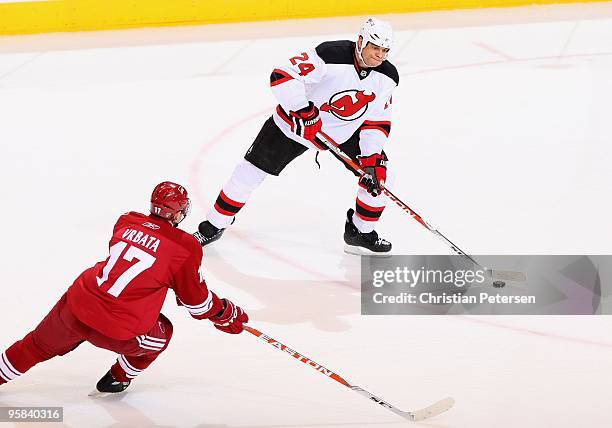 Bryce Salvador of the New Jersey Devils looks to pass the puck during the NHL game against the Phoenix Coyotes at Jobing.com Arena on January 14,...