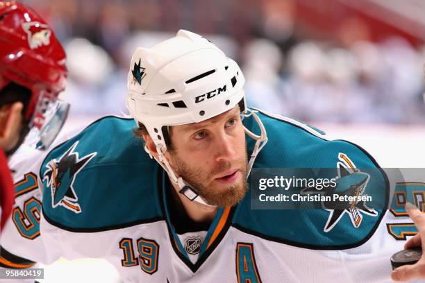 Joe Thornton of the San Jose Sharks awaits a face off during the NHL game against the Phoenix Coyotes at Jobing.com Arena on January 12, 2010 in...
