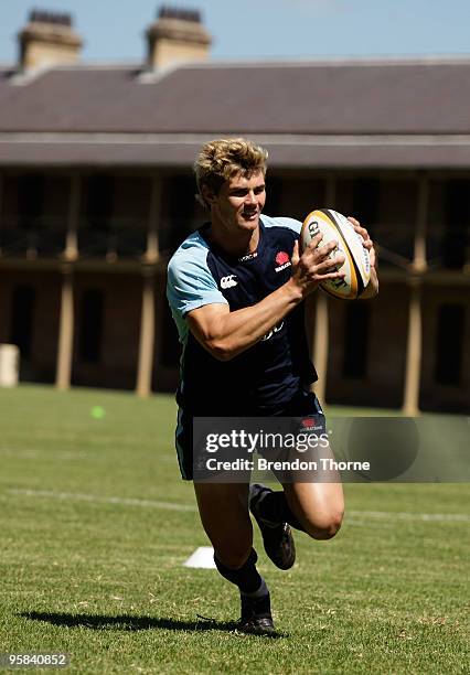 Berrick Barnes runs with the ball during a New South Wales Waratahs Super 14 training session at Victoria Barracks on January 18, 2010 in Sydney,...