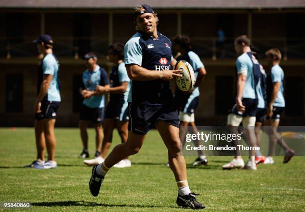 Phil Waugh runs with the ball during a New South Wales Waratahs Super 14 training session at Victoria Barracks on January 18, 2010 in Sydney,...