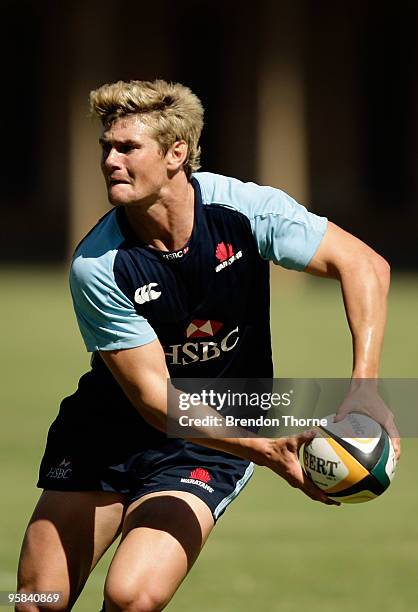 Berrick Barnes runs with the ball during a New South Wales Waratahs Super 14 training session at Victoria Barracks on January 18, 2010 in Sydney,...