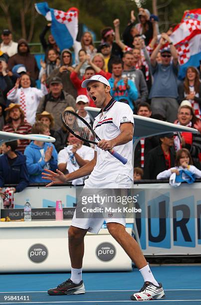 Ivo Karlovic of Croatia celebrates winning match point after his first round match against Radek Stepanek of the Czech Republic during day one of the...