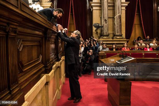 Quim Torra shakes hands with the President of the Parliament of Catalonia Roger Torrent after being elected as the new President of Catalonia during...