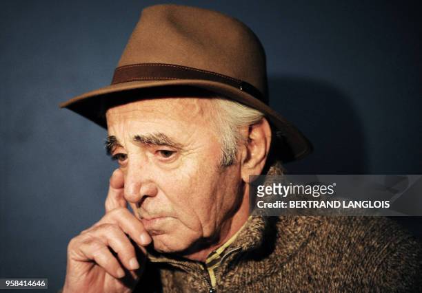French singer Charles Aznavour gives an interview after recording, with a dozen of French rappers and pop stars, a music video to raise funds for...