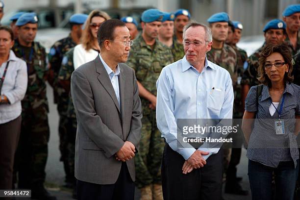 In this handout image provided by the United Nations Stabilization Mission in Haiti , UN Secratary General Ban Ki-moon and Acting SRSG, Edmond Mullet...