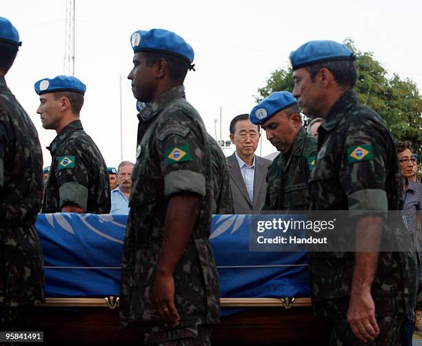 In this handout image provided by the United Nations Stabilization Mission in Haiti , UN Secratary General Ban Ki-moon sattend a memorial service for...