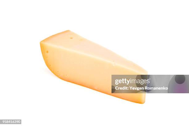 triangle cheese chunk isolated on white background - queso gouda fotografías e imágenes de stock