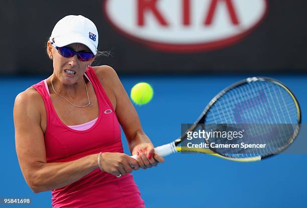 Anastasia Rodionova of Australia plays a backhand in her first round match against Svetlana Kuznetsova of Russia during day one of the 2010...