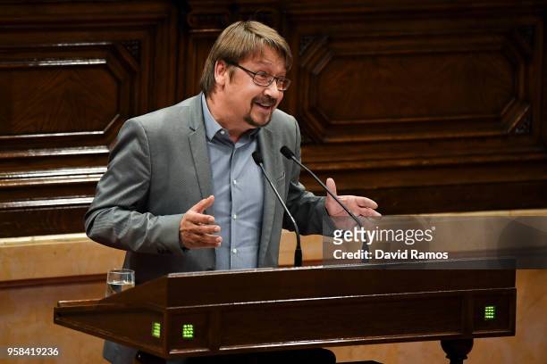 Xavier Domenech, leader of Catalunya En Comu Podem, gives a speech during the second day of the parliamentary session debating on his investiture as...
