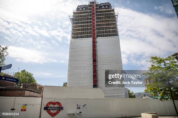 Grenfell Tower stands covered in scaffolding on May 14, 2018 in London, England. Survivors and relatives of the victims of the Grenfell Tower fire...
