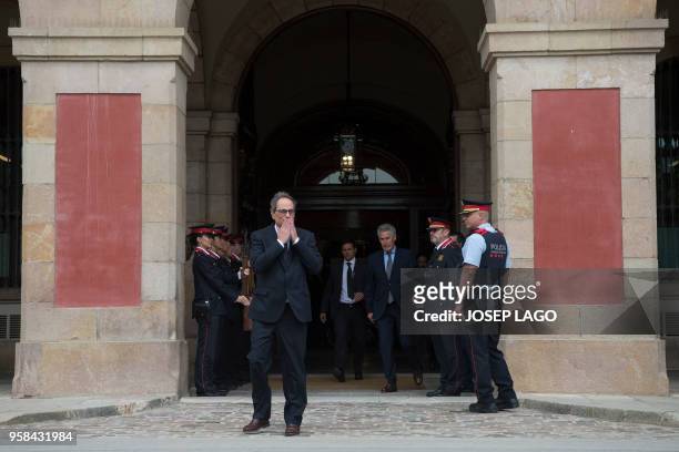The new elected Catalan regional president Quim Torra blows a kiss as he leaves the Catalan parliament after his election during a parliamentary vote...