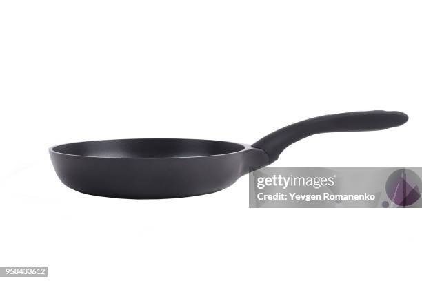 black frying pan with a non-stick teflon coating, isolated over the white background - polytetrafluoroethylene stock pictures, royalty-free photos & images