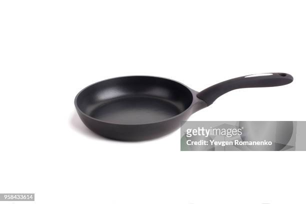 black frying pan with a non-stick teflon coating, isolated over the white background - frying pan stock pictures, royalty-free photos & images