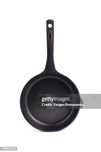 black frying pan with a non-stick teflon coating, isolated over the white background - polytetrafluoroethylene stock pictures, royalty-free photos & images